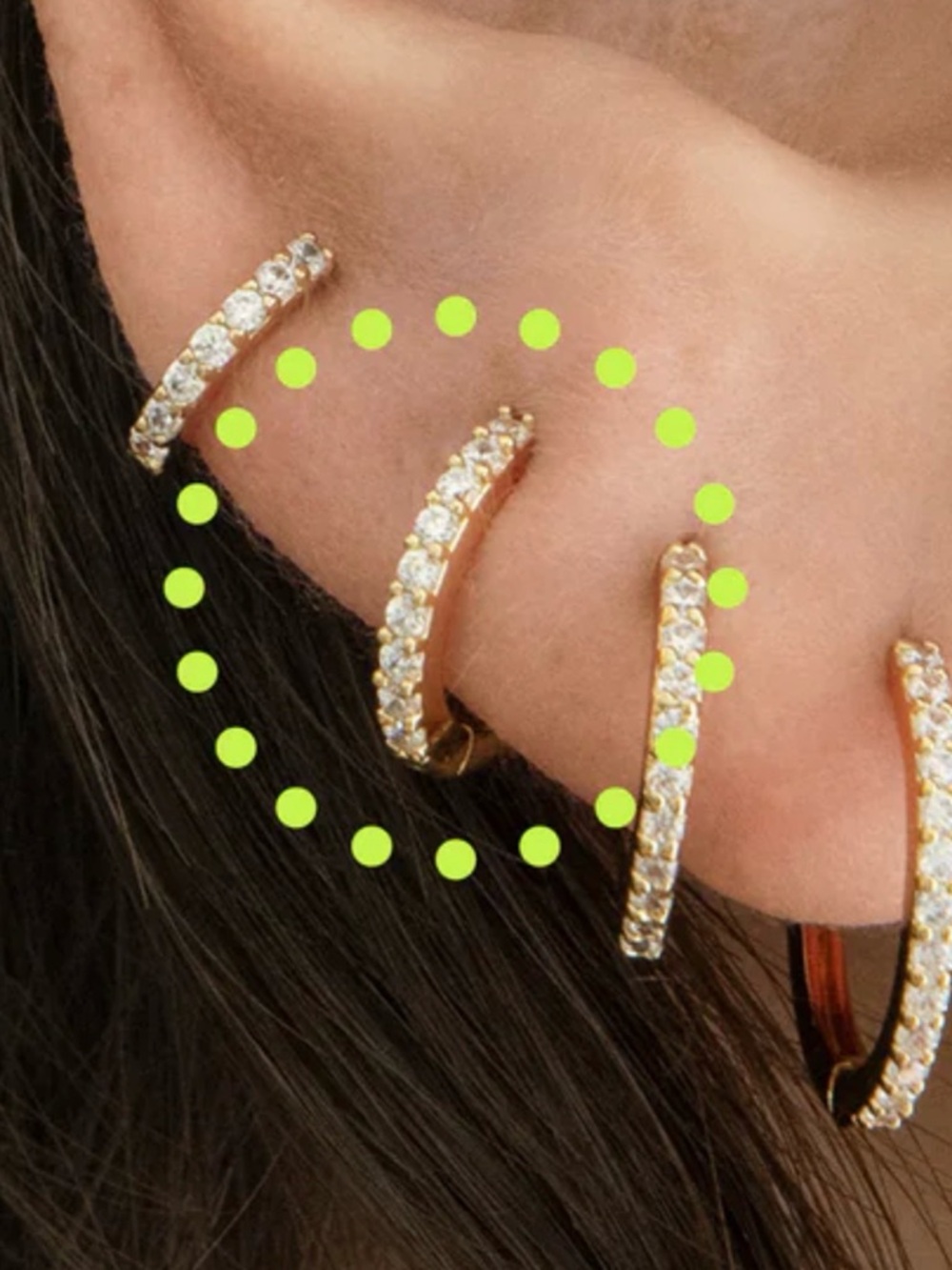 A pair of Mini Pavé Huggie Earrings in Gold with Clear Stones